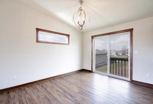 unfurnished room featuring baseboards, an inviting chandelier, dark wood-style flooring, and plenty of natural light