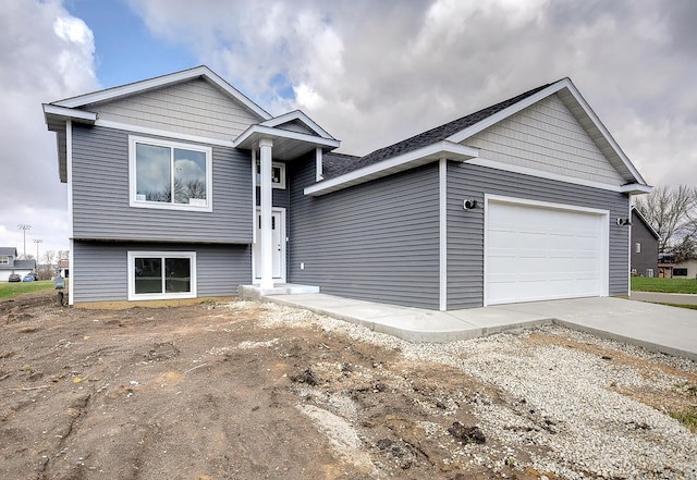 view of front facade with an attached garage and concrete driveway
