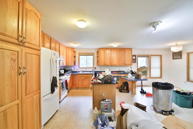 21682 Rebel Rd, Center Twp, MN 56465 - kitchen with white appliances, open shelves, a breakfast bar area, a kitchen island, and dark countertops