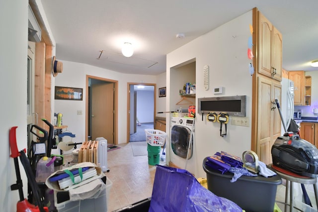 21682 Rebel Rd, Center Twp, MN 56465 - kitchen featuring washer / dryer, light brown cabinets, and freestanding refrigerator