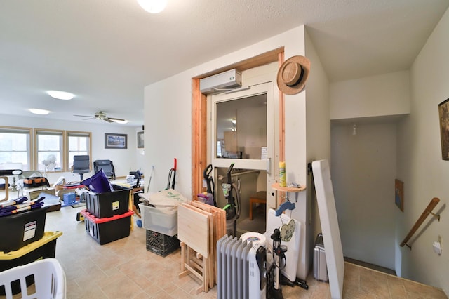 21682 Rebel Rd, Center Twp, MN 56465 - living room with a wall mounted AC and ceiling fan
