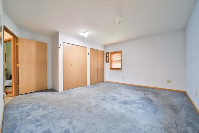 21682 Rebel Rd, Center Twp, MN 56465 - unfurnished bedroom with two closets and carpet flooring