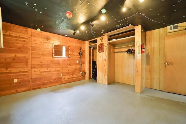 21682 Rebel Rd, Center Twp, MN 56465 - interior space featuring concrete floors and wood walls