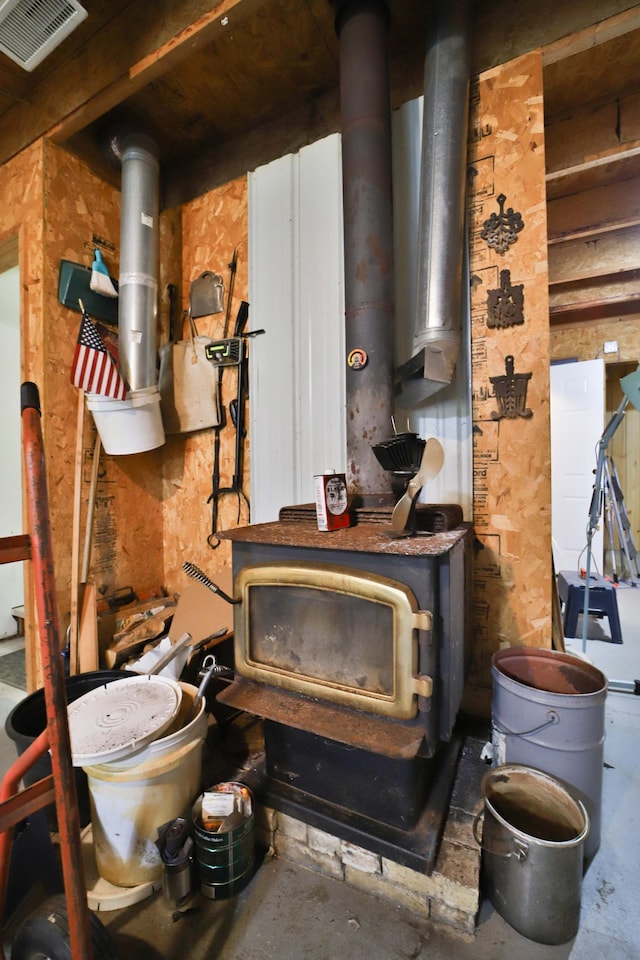 21682 Rebel Rd, Center Twp, MN 56465 - detailed view of a wood stove and unfinished concrete flooring