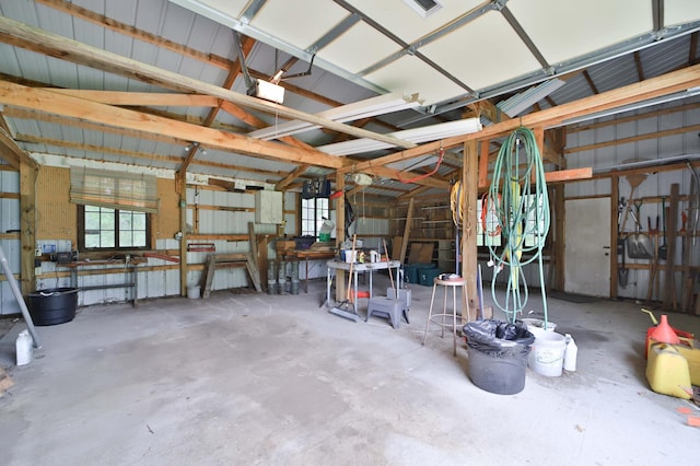 21682 Rebel Rd, Center Twp, MN 56465 - garage featuring a workshop area