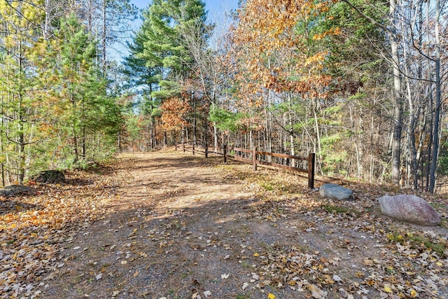 view of street featuring a forest view
