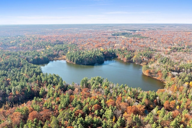 aerial view with a wooded view and a water view