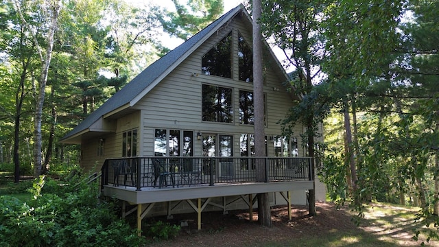 back of house featuring a wooden deck