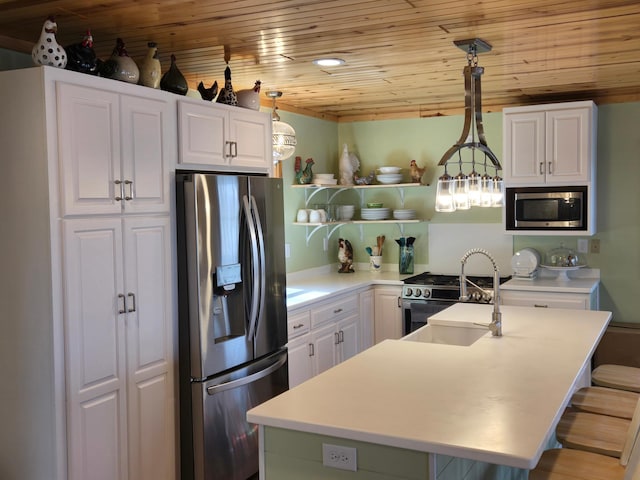 kitchen featuring white cabinets, a sink, light countertops, appliances with stainless steel finishes, and wood ceiling