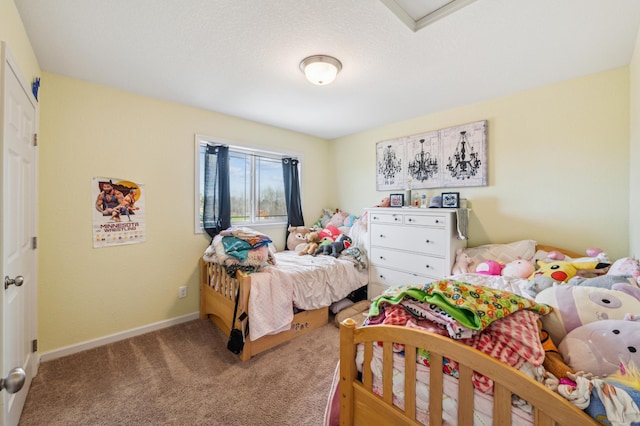 carpeted bedroom with baseboards