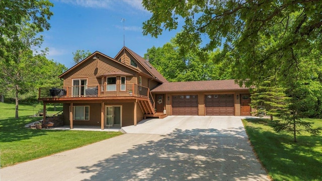 12468 Hermosa Beach Rd NW, Alexandria, MN 56308 - view of front of house featuring driveway, an attached garage, a front lawn, and a deck