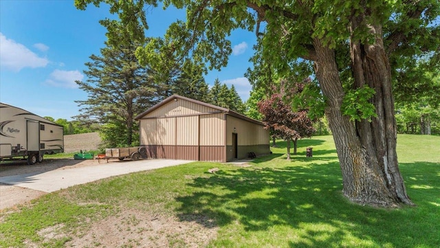 12468 Hermosa Beach Rd NW, Alexandria, MN 56308 - view of green lawn with a detached garage and an outdoor structure
