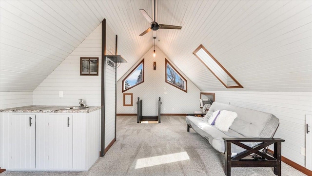 12468 Hermosa Beach Rd NW, Alexandria, MN 56308 - living area featuring a ceiling fan, light colored carpet, lofted ceiling, baseboards, and wooden ceiling