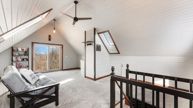 12468 Hermosa Beach Rd NW, Alexandria, MN 56308 - bedroom with a skylight, vaulted ceiling, carpet flooring, and wooden walls