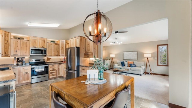 12468 Hermosa Beach Rd NW, Alexandria, MN 56308 - kitchen featuring stainless steel appliances, lofted ceiling, light brown cabinets, a chandelier, and open floor plan