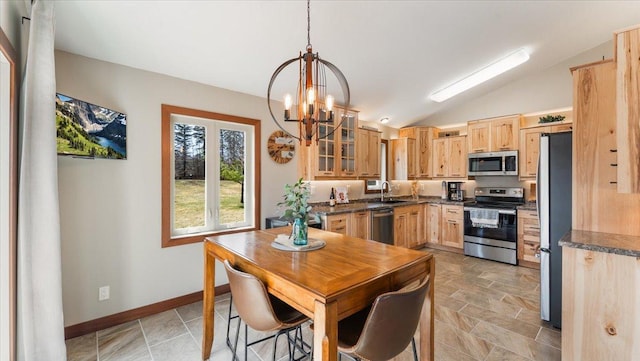 12468 Hermosa Beach Rd NW, Alexandria, MN 56308 - kitchen featuring appliances with stainless steel finishes, light brown cabinets, a sink, dark countertops, and lofted ceiling
