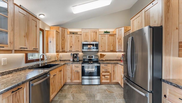 12468 Hermosa Beach Rd NW, Alexandria, MN 56308 - kitchen featuring appliances with stainless steel finishes, light brown cabinetry, a sink, vaulted ceiling, and glass insert cabinets
