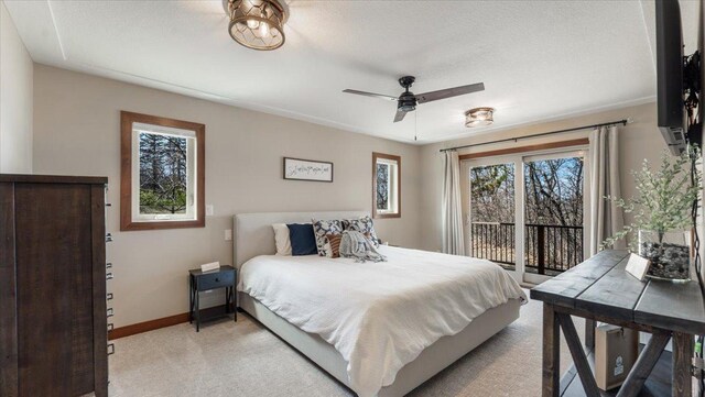 12468 Hermosa Beach Rd NW, Alexandria, MN 56308 - bedroom with light carpet, access to exterior, baseboards, and a ceiling fan