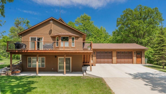 12468 Hermosa Beach Rd NW, Alexandria, MN 56308 - rear view of house with an attached garage, driveway, a wooden deck, and a lawn