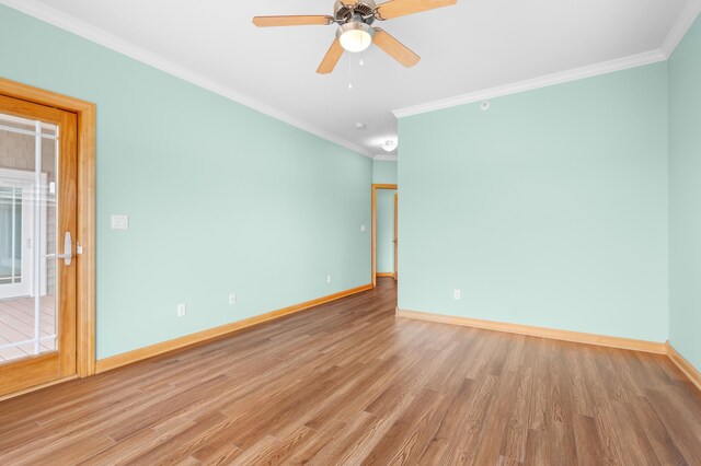 200 Michigan St Unit 1, Lake City, MN 55041 - unfurnished room featuring wood finished floors, a ceiling fan, baseboards, and ornamental molding