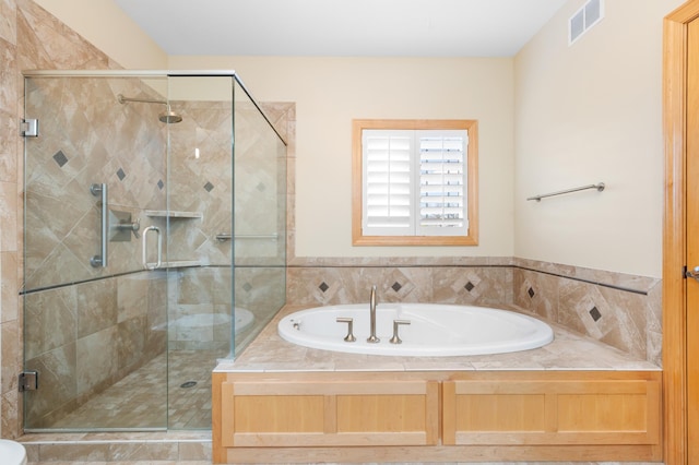 200 Michigan St Unit 1, Lake City, MN 55041 - bathroom featuring a garden tub, visible vents, and a stall shower