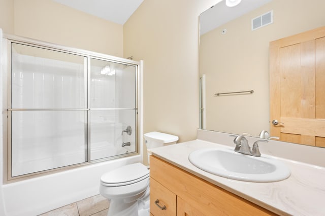 200 Michigan St Unit 1, Lake City, MN 55041 - bathroom with tile patterned floors, bath / shower combo with glass door, toilet, visible vents, and vanity