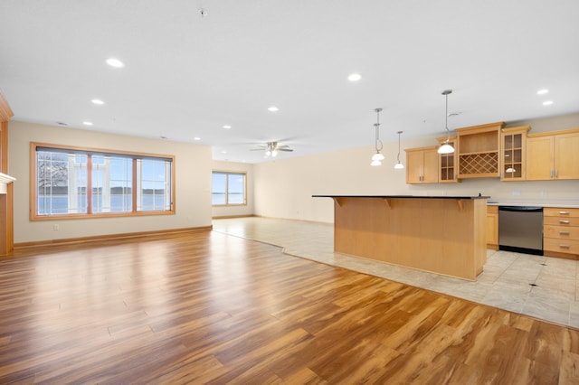 200 Michigan St Unit 1, Lake City, MN 55041 - kitchen featuring open floor plan, recessed lighting, light wood-style floors, dishwasher, and a breakfast bar area