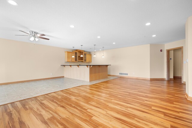200 Michigan St Unit 1, Lake City, MN 55041 - unfurnished living room with recessed lighting, visible vents, light wood finished floors, and ceiling fan