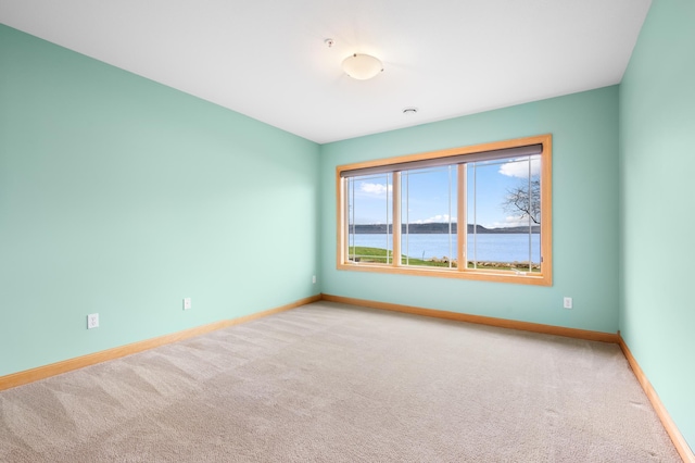 200 Michigan St Unit 1, Lake City, MN 55041 - unfurnished room with baseboards and light colored carpet