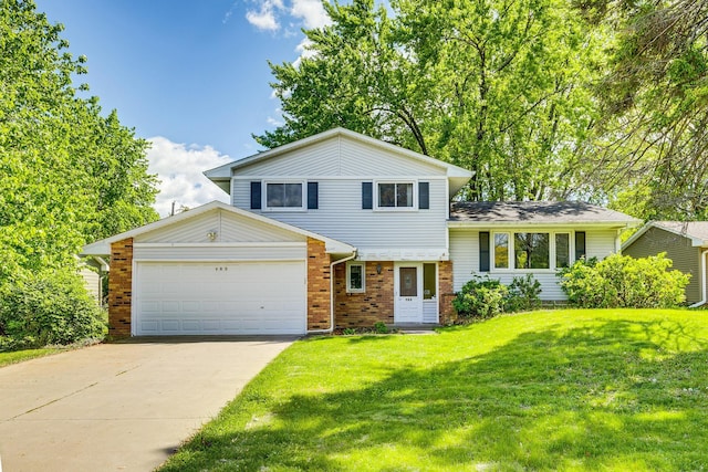 980 Carlton Dr, Shoreview, MN 55126 - tri-level home featuring a garage, a front lawn, concrete driveway, and brick siding