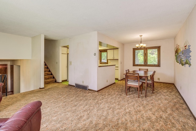 980 Carlton Dr, Shoreview, MN 55126 - carpeted dining space featuring a chandelier, stairs, and baseboards