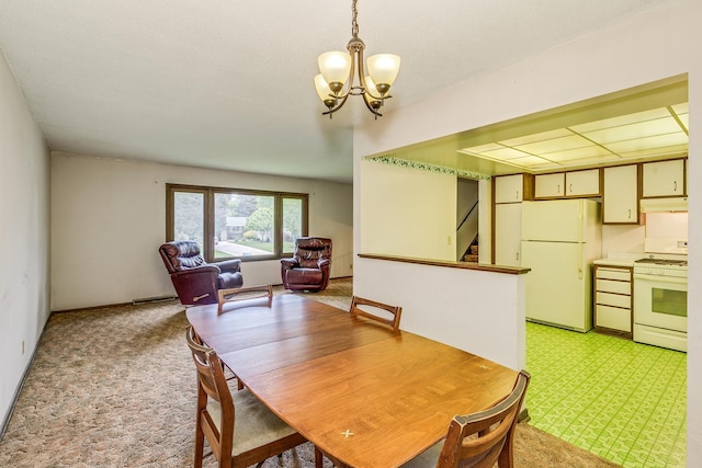 980 Carlton Dr, Shoreview, MN 55126 - dining space featuring light colored carpet, a chandelier, and stairs