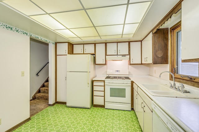 980 Carlton Dr, Shoreview, MN 55126 - kitchen with white appliances, under cabinet range hood, light countertops, a sink, and a drop ceiling
