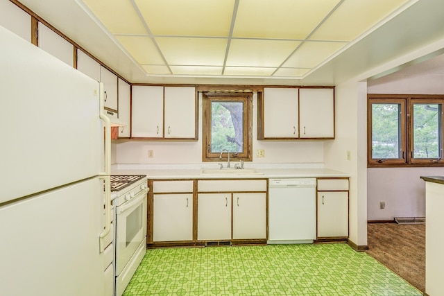 980 Carlton Dr, Shoreview, MN 55126 - kitchen with white appliances, a sink, light countertops, and white cabinetry