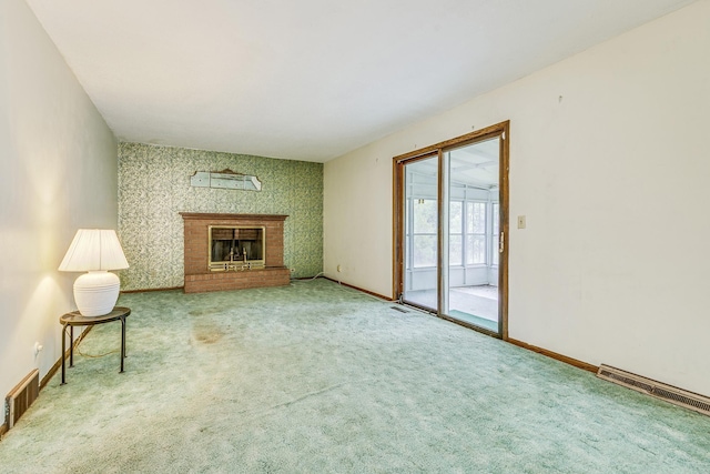 980 Carlton Dr, Shoreview, MN 55126 - unfurnished living room featuring carpet, a brick fireplace, and baseboards