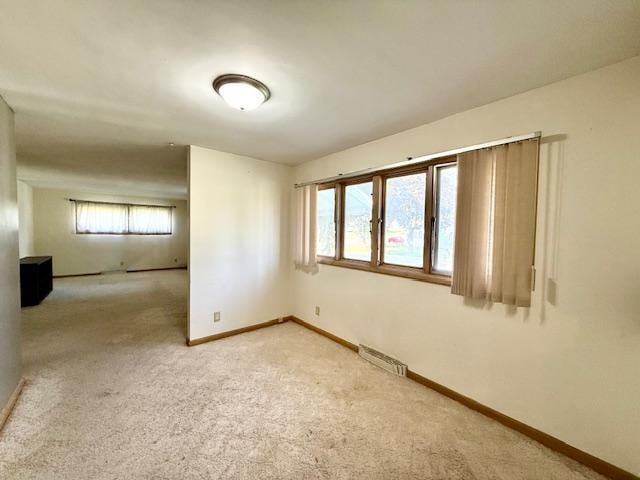 106 Mcphail Ave N, Caledonia, MN 55921 - unfurnished room featuring healthy amount of natural light and light carpet