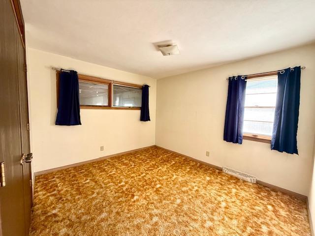 106 Mcphail Ave N, Caledonia, MN 55921 - spare room featuring baseboards and carpet floors