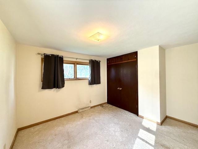 106 Mcphail Ave N, Caledonia, MN 55921 - unfurnished bedroom featuring light colored carpet and a closet