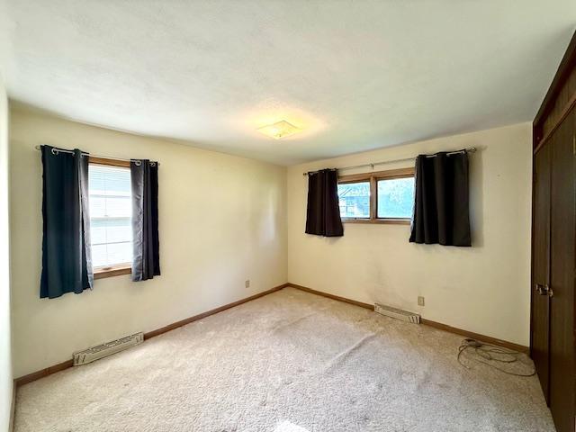 106 Mcphail Ave N, Caledonia, MN 55921 - unfurnished room featuring light carpet and baseboards