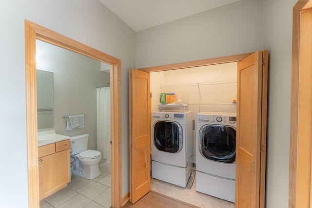 630 Main St N Unit 308, Stillwater, MN 55082 - laundry area with washing machine and dryer and light tile patterned flooring