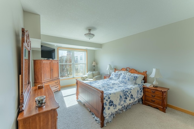 630 Main St N Unit 308, Stillwater, MN 55082 - carpeted bedroom featuring baseboards and a textured ceiling