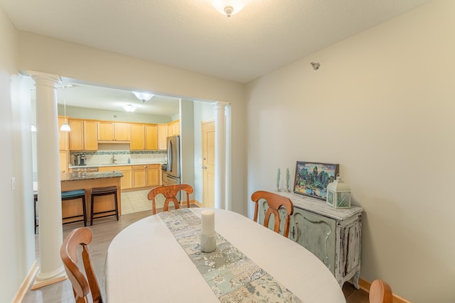 630 Main St N Unit 308, Stillwater, MN 55082 - dining space featuring baseboards and decorative columns