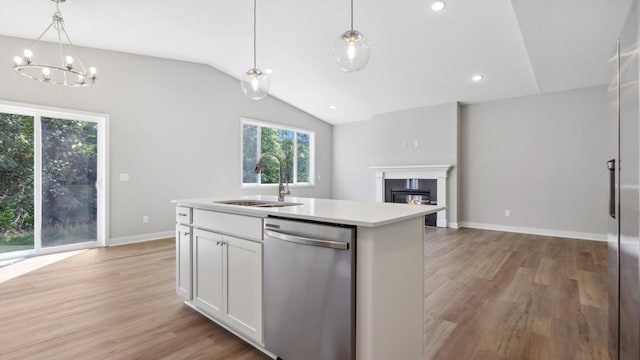 7510 170th Ave, Ramsey, MN 55303 - kitchen with light wood-style flooring, an inviting chandelier, a sink, vaulted ceiling, and stainless steel dishwasher