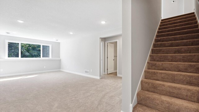 7510 170th Ave, Ramsey, MN 55303 - staircase featuring carpet floors, baseboards, recessed lighting, and visible vents
