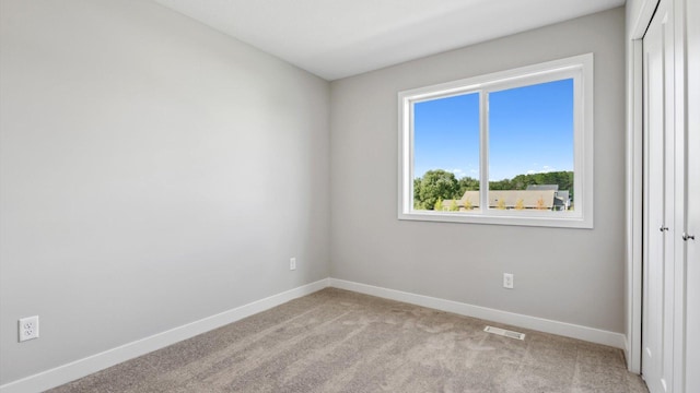 7510 170th Ave, Ramsey, MN 55303 - spare room featuring baseboards, visible vents, and carpet floors