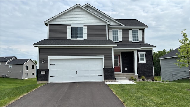 10080 Twin Lakes Pkwy NW, Elk River, MN 55330 - craftsman-style home with a garage, driveway, a front yard, and stone siding