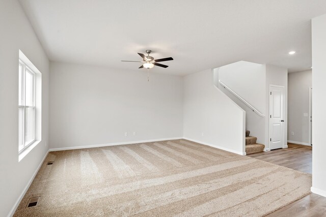 10080 Twin Lakes Pkwy NW, Elk River, MN 55330 - unfurnished room with ceiling fan, stairway, recessed lighting, and light wood-style flooring