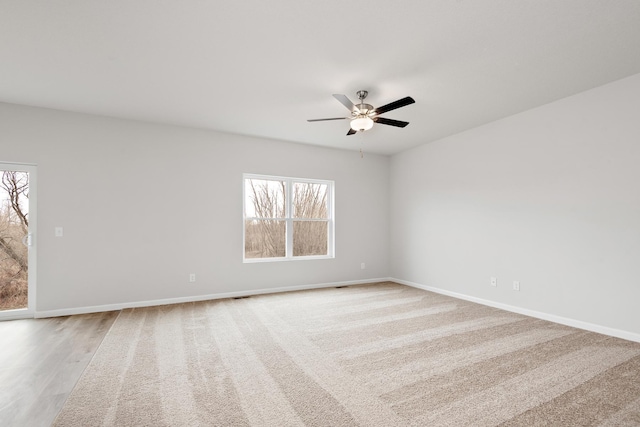 10080 Twin Lakes Pkwy NW, Elk River, MN 55330 - empty room with plenty of natural light and a ceiling fan