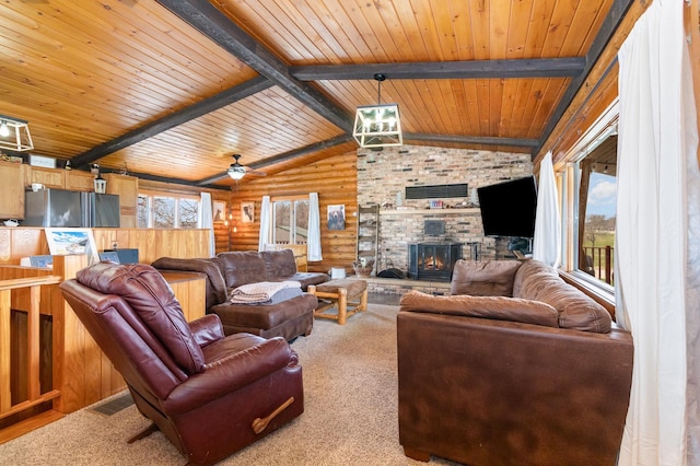 carpeted living area with a ceiling fan, wood ceiling, lofted ceiling with beams, a brick fireplace, and log walls