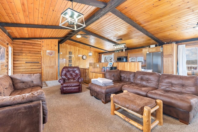 living area with carpet floors, vaulted ceiling with beams, and wood ceiling